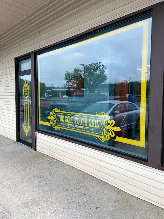 The Gold Tooth Grin Tattoo Company 0