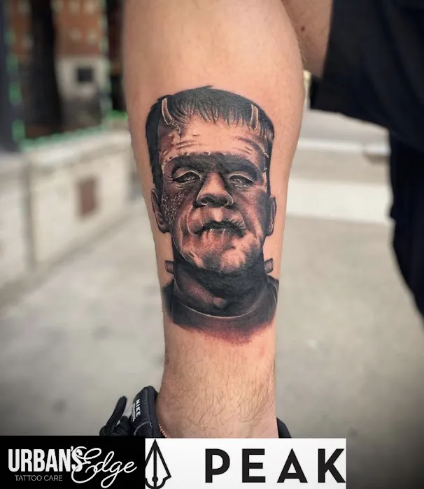 Knuckles & Needles Tattoo Parlor 0