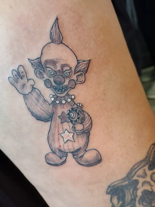 Cursed World tattoo and body piercing 0