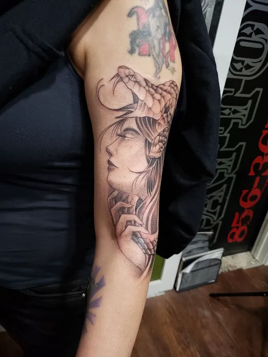 Sinful Art Tattoo 0