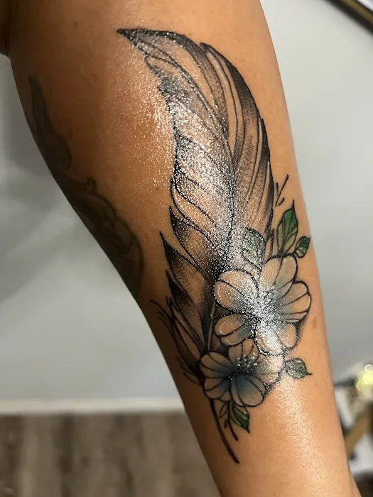 Black Cloud Tattoo and Piercing 0