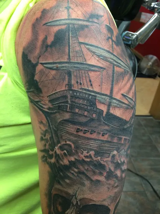 Revolution Studios tattoo 7