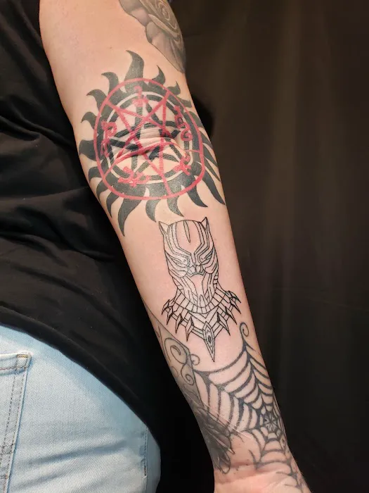 Omega Point Tattoo 1