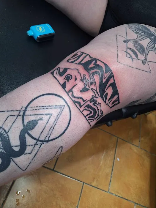 Sacred-X-Pressions Tattoo Studio 0