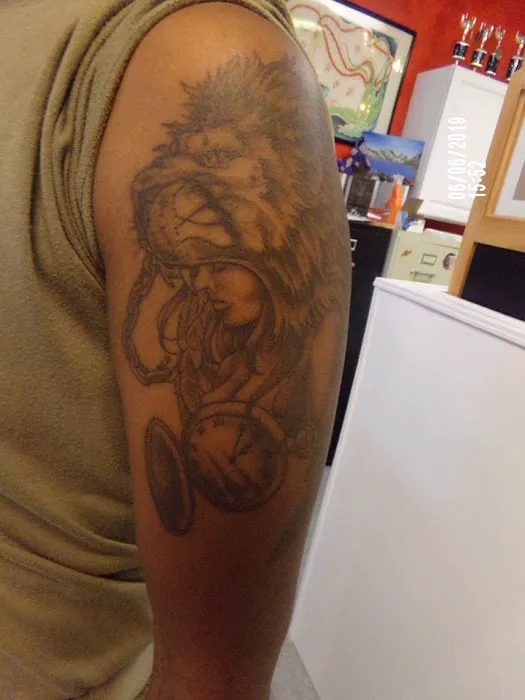 Barfield’s tattoo and piercing 3