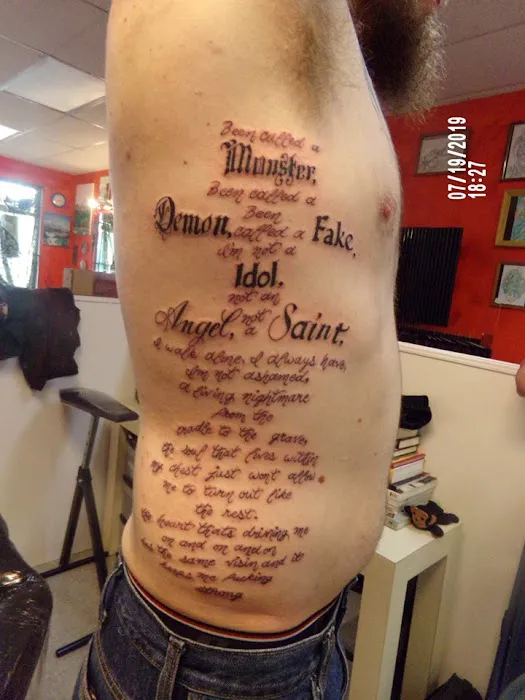 Barfield’s tattoo and piercing 5