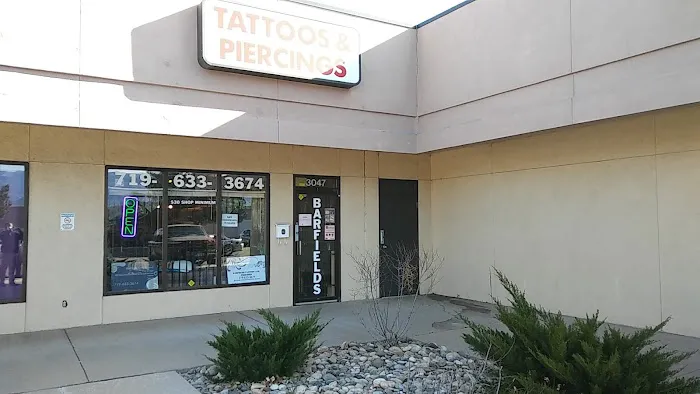 Barfield’s tattoo and piercing 1