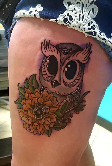 Flying Dagger Tattoo and Piercing 0