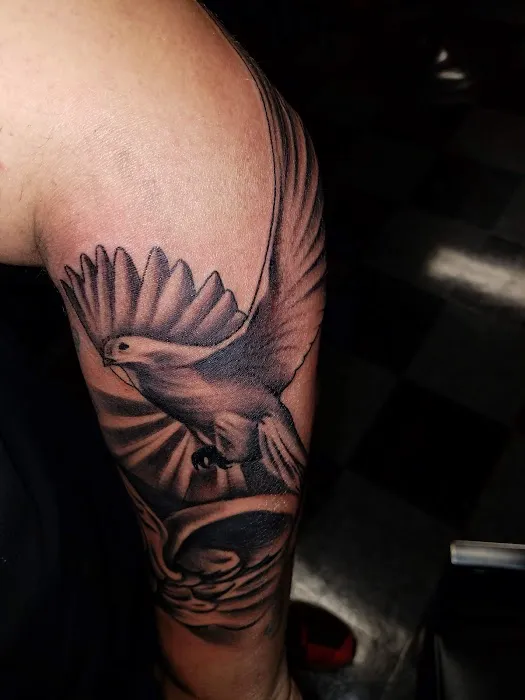 Uptown Tattoos & Piercing 1