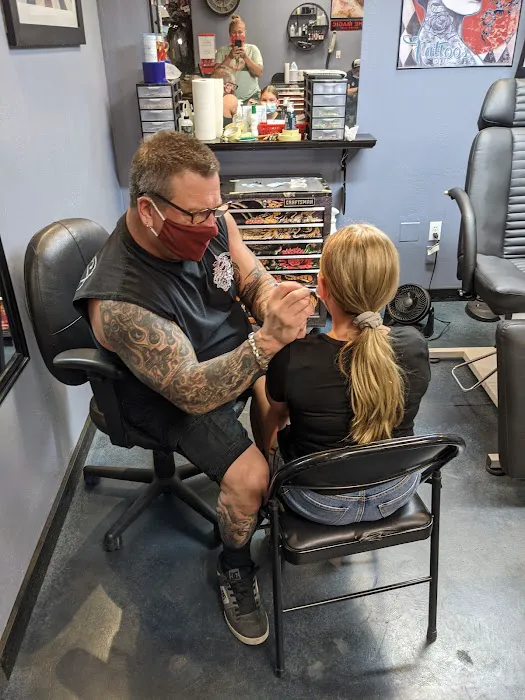 Extreme Tattoo, Piercing & Tanning & Hair Salon 0